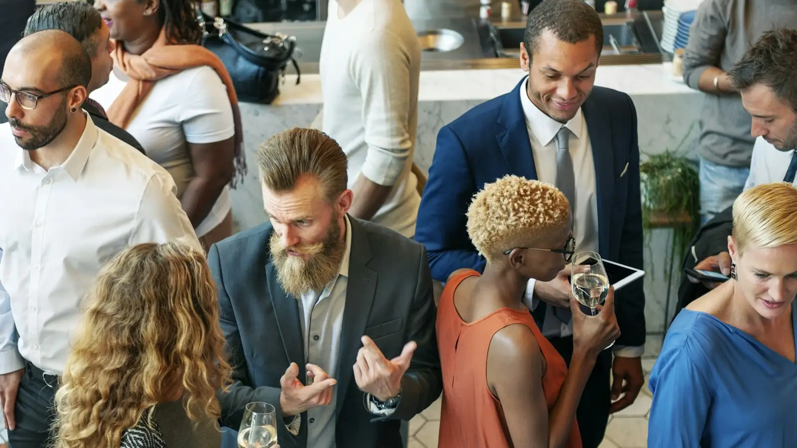 A group of people standing around each other