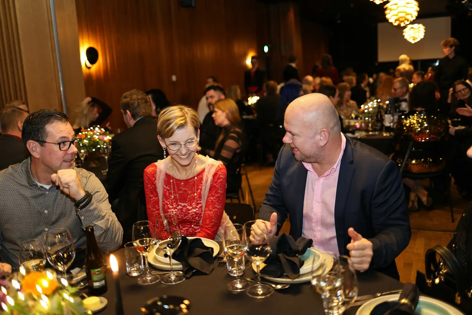 People gathered at a formal dinner event