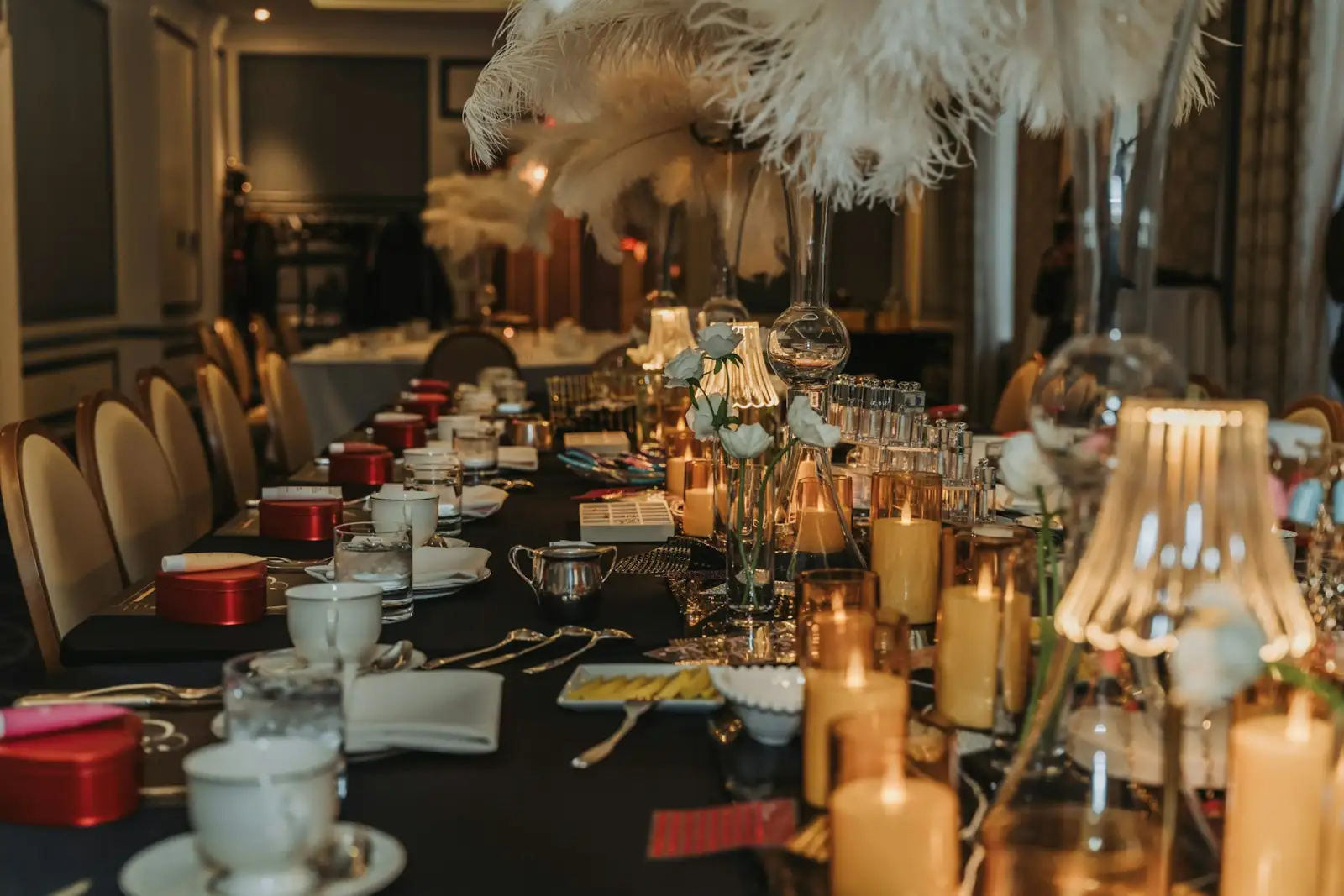 Elegant table setting with candles and teacups