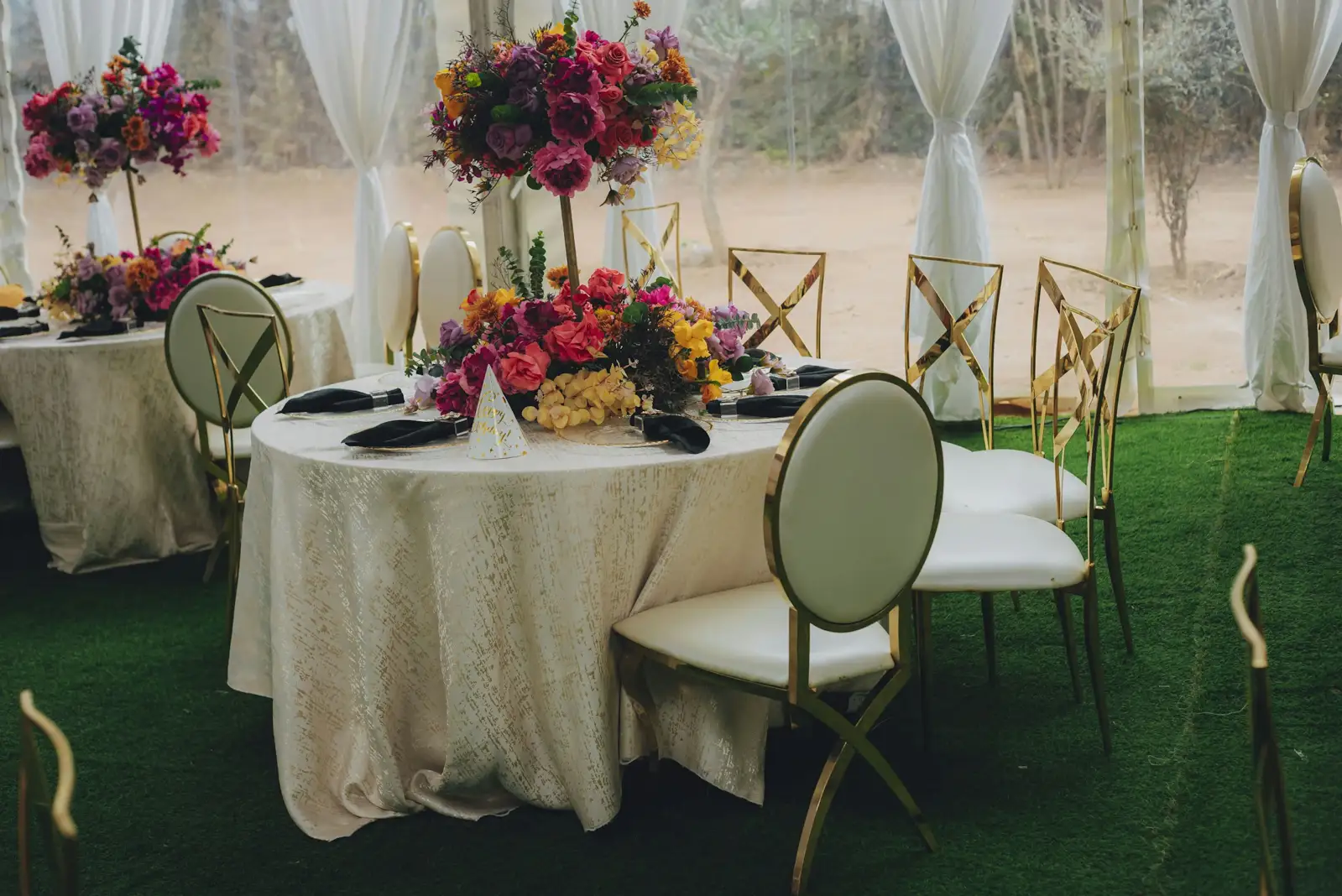 Elegant tables set with colorful floral arrangements for an event