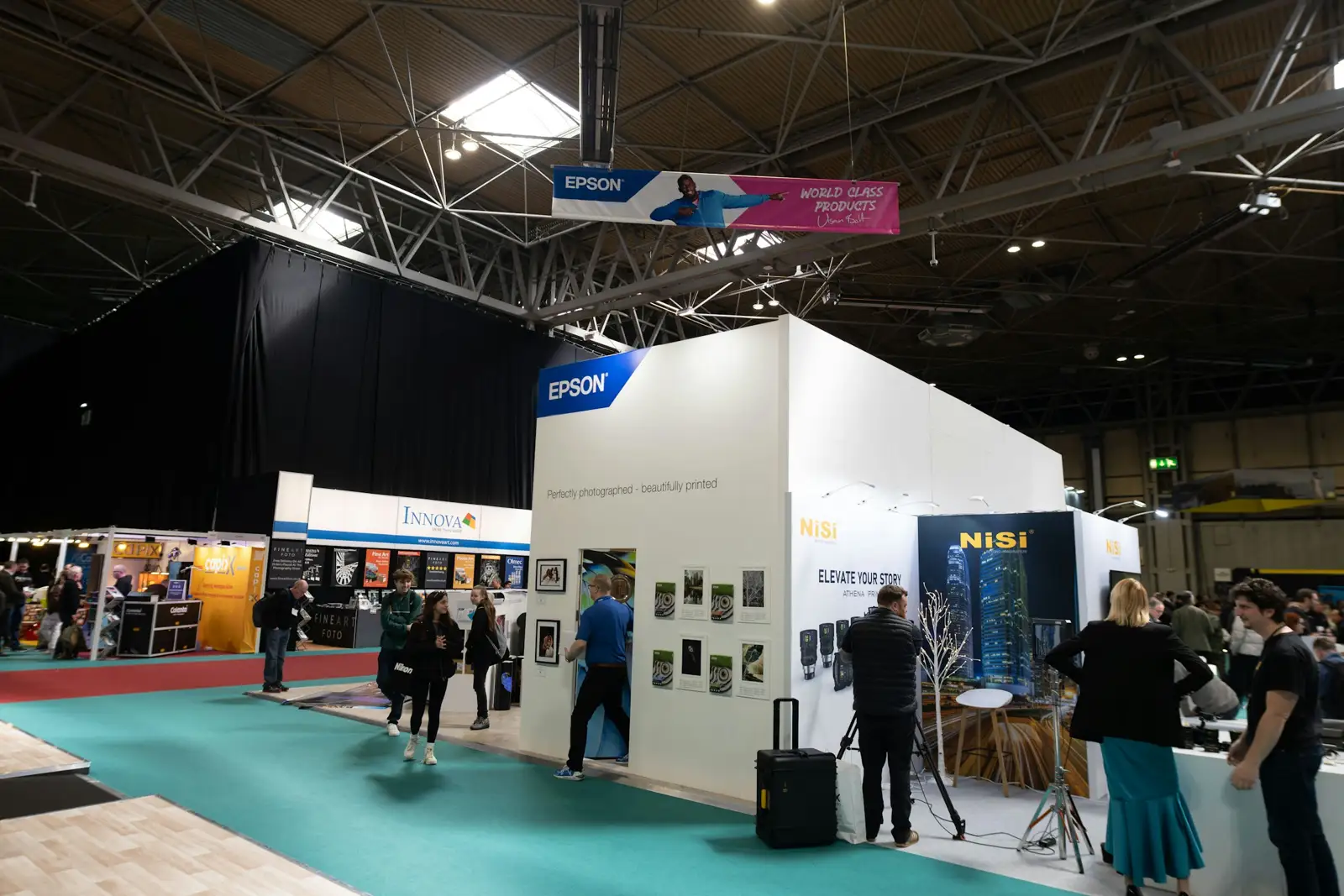Visitors gathered around a trade show exhibitor booth
