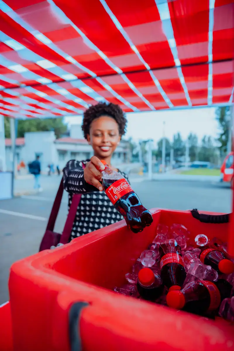 Guest interacting with a colourful branded event installation