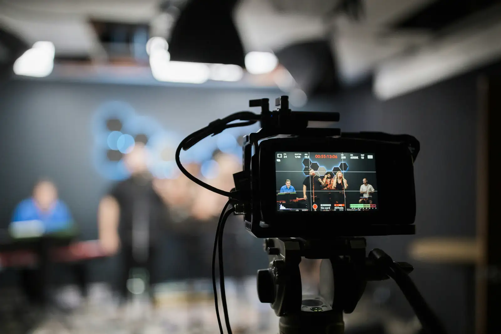 Video camera recording a speaker at an indoor event