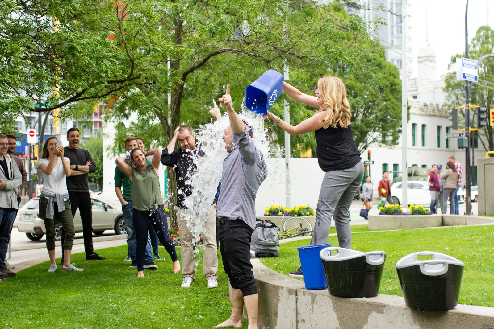 Participants taking part in an outdoor ice bucket fundraising event