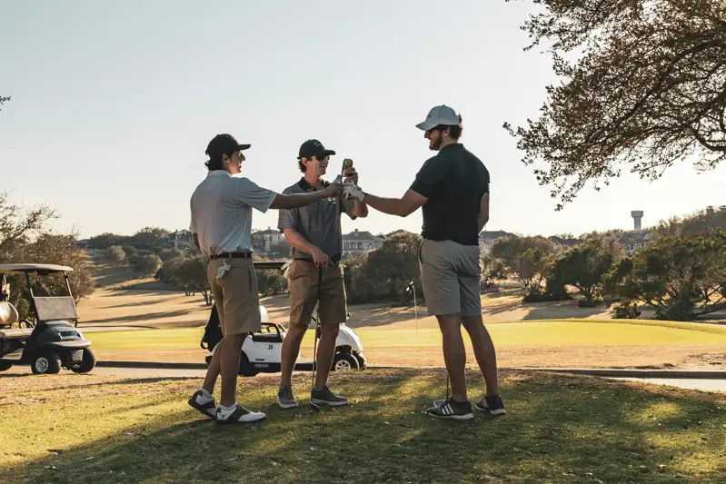 Golfers greeting one another beside golf carts on a course