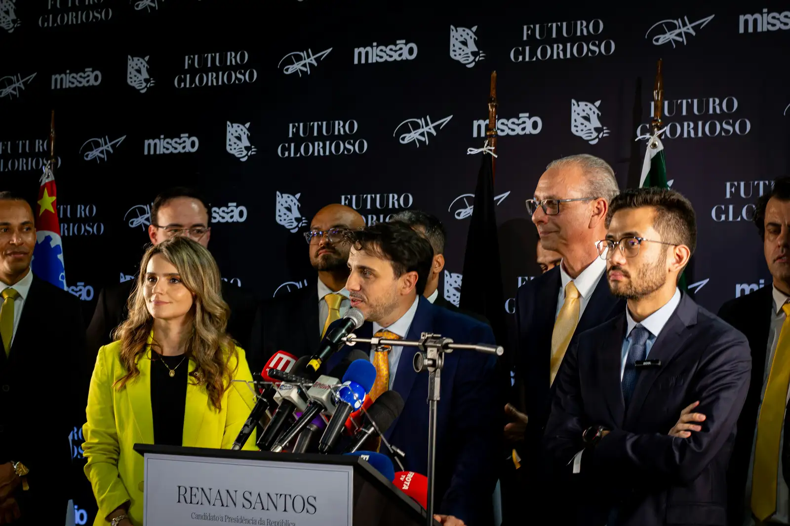 Spokesperson addressing microphones at a press conference