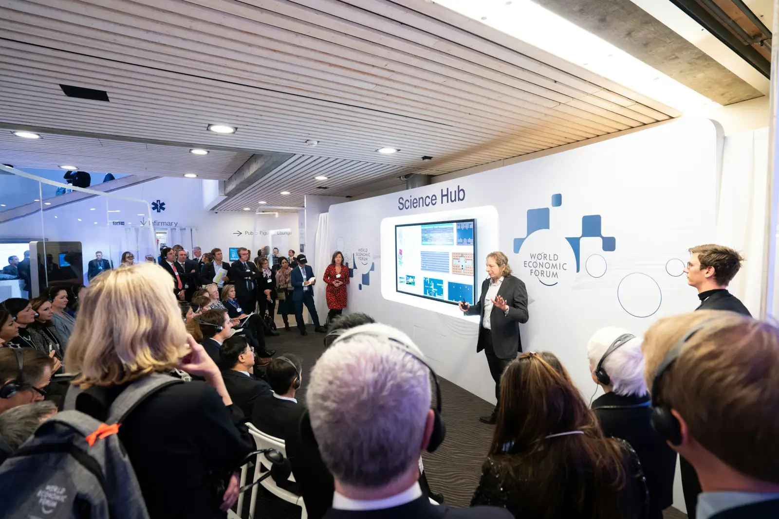 Guests watching a presentation at a product event