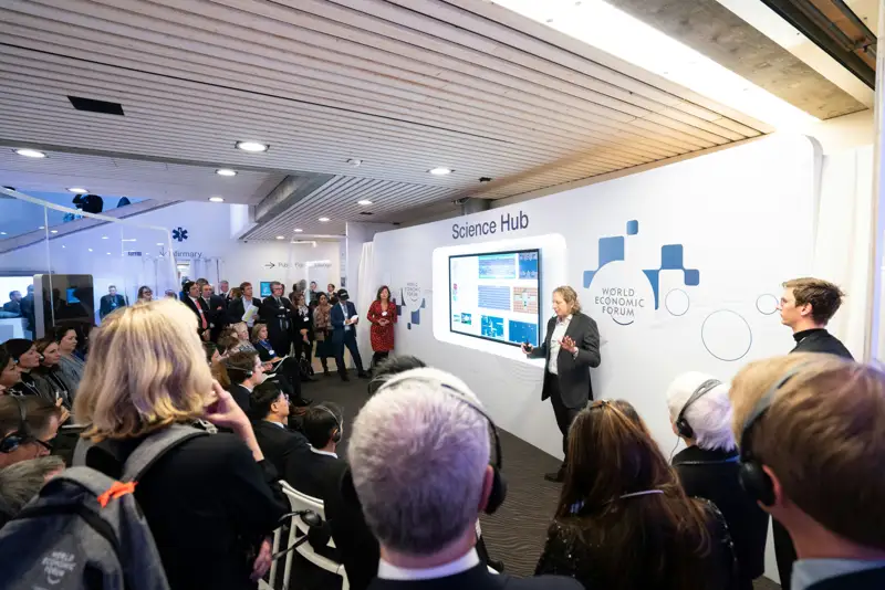 Guests watching a presentation at a product event