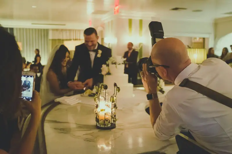Photographer photographing guests during a reception