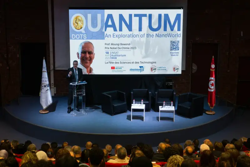 Speaker presents at quantum dots event on stage